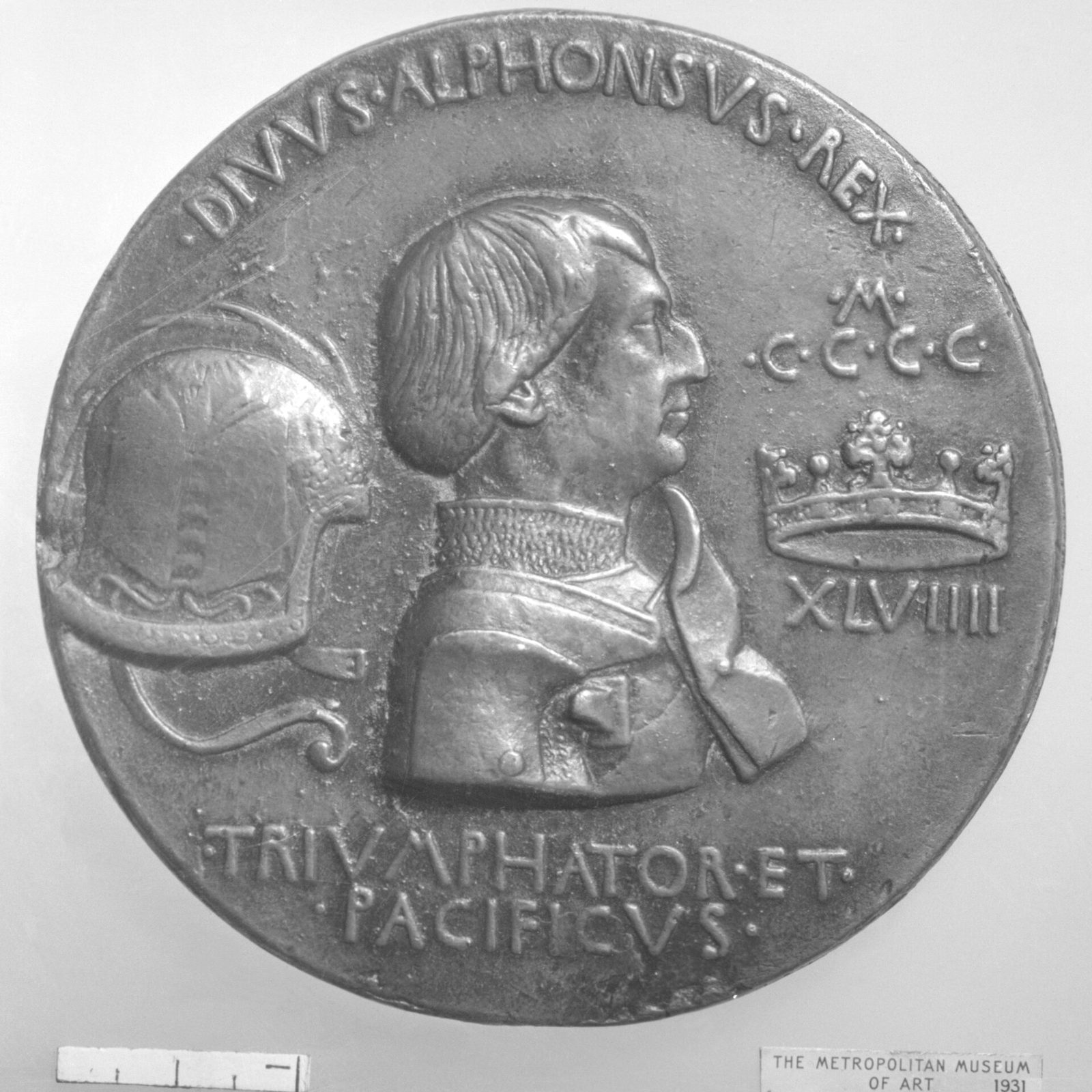 A cast bronze medal with a bust in profile in armour, a helmet and a crown on either side and a Latin legend around the rim.