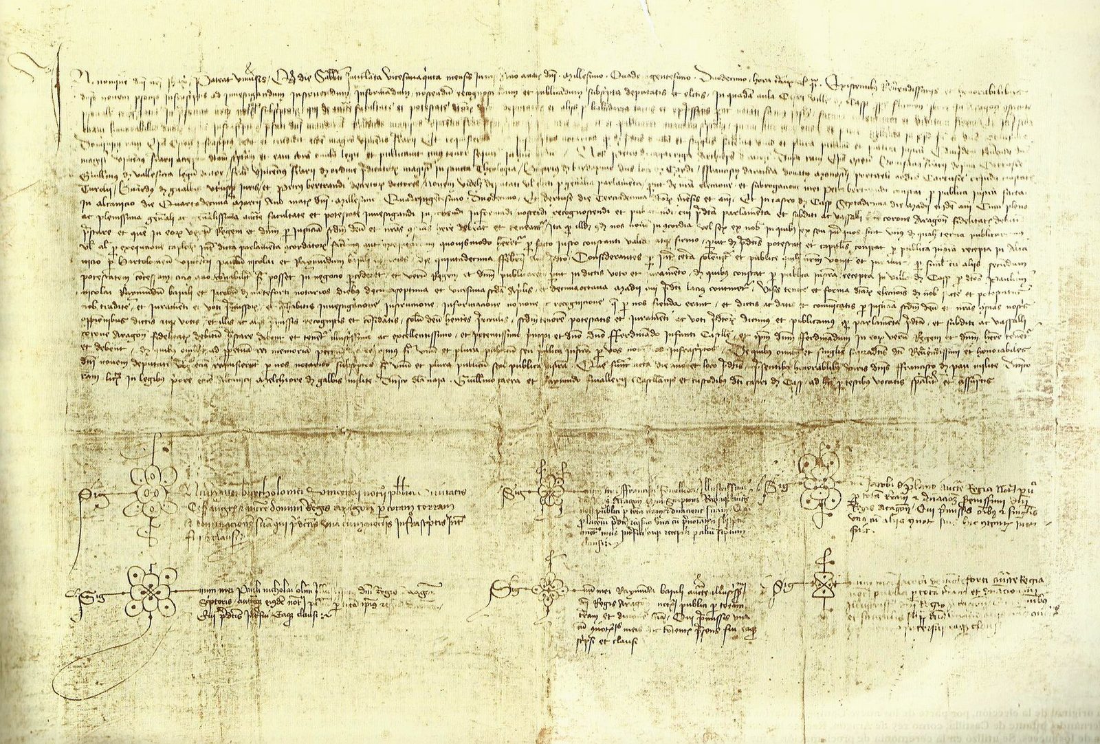 A sheet of parchment covered in lines of Gothic notarial handwriting, with notaries' marks at the foot.