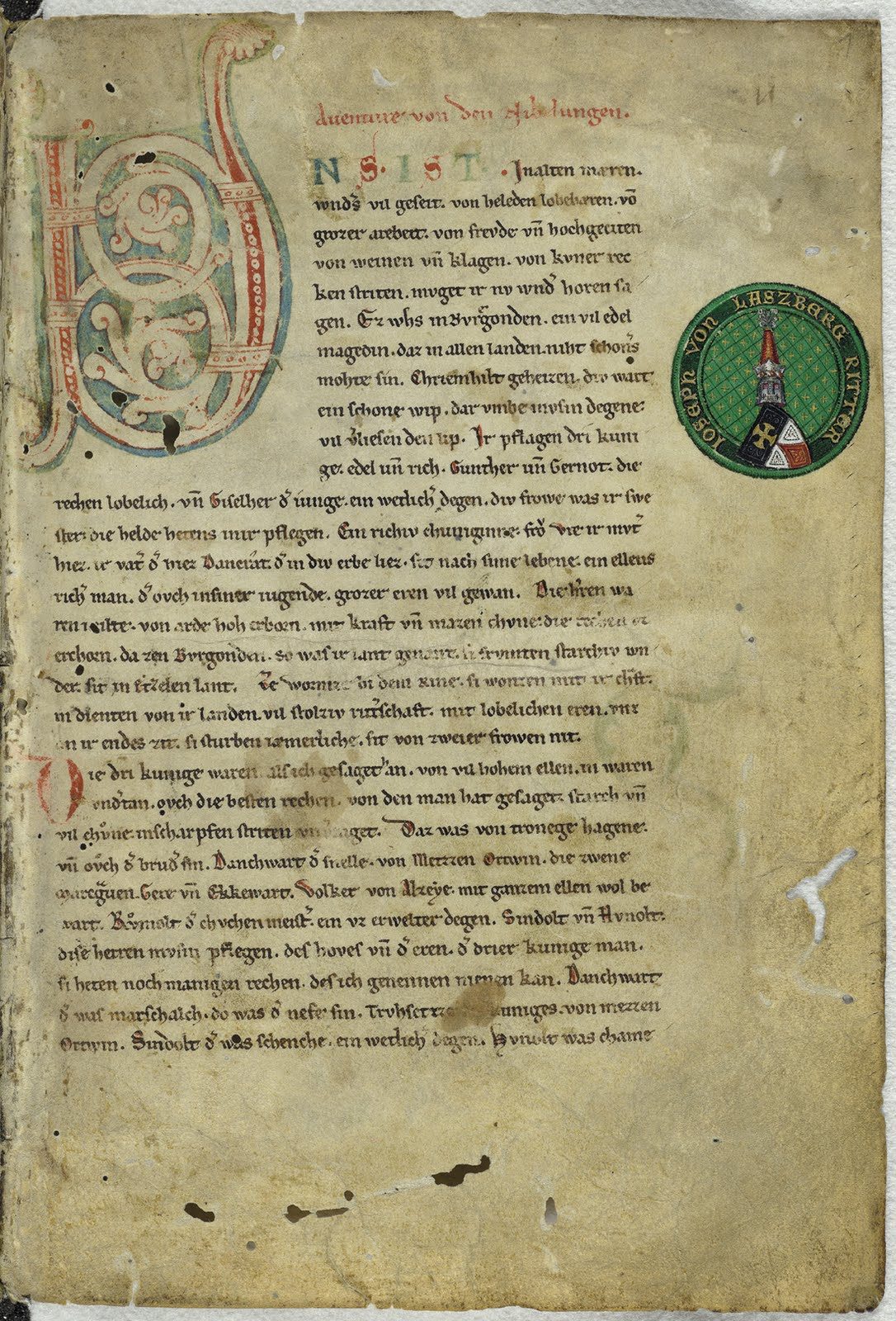 A manuscript page in two columns of Gothic script with a large red and blue initial at the head of the left column and smaller coloured initials down both.