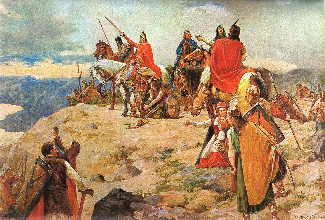 A painting of riders, warriors and families on a rocky height looking out over the sea.