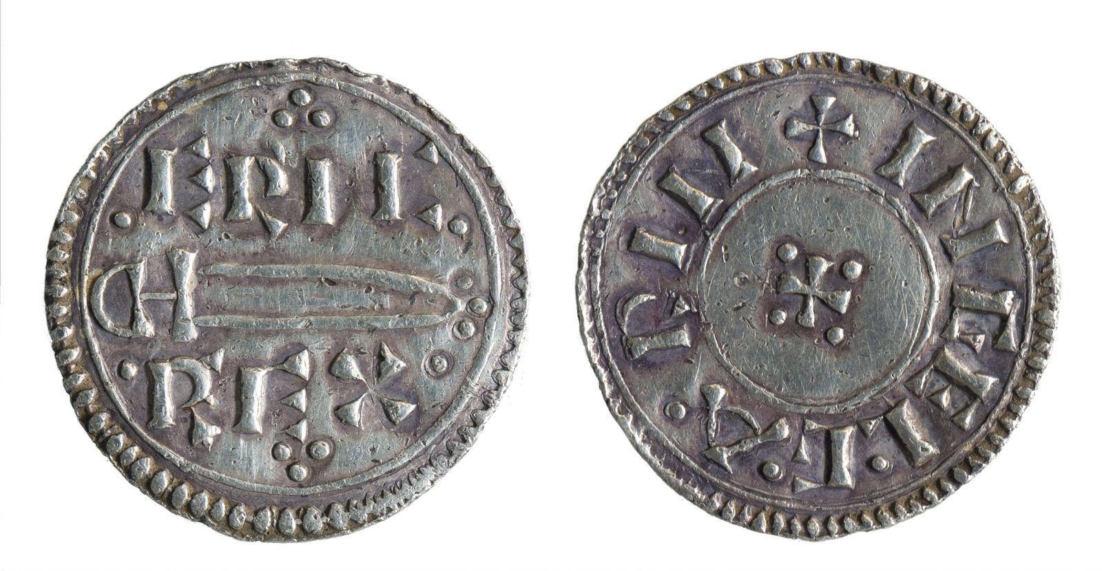 Both faces of a silver penny, a sword between the words ERIC REX on one side.
