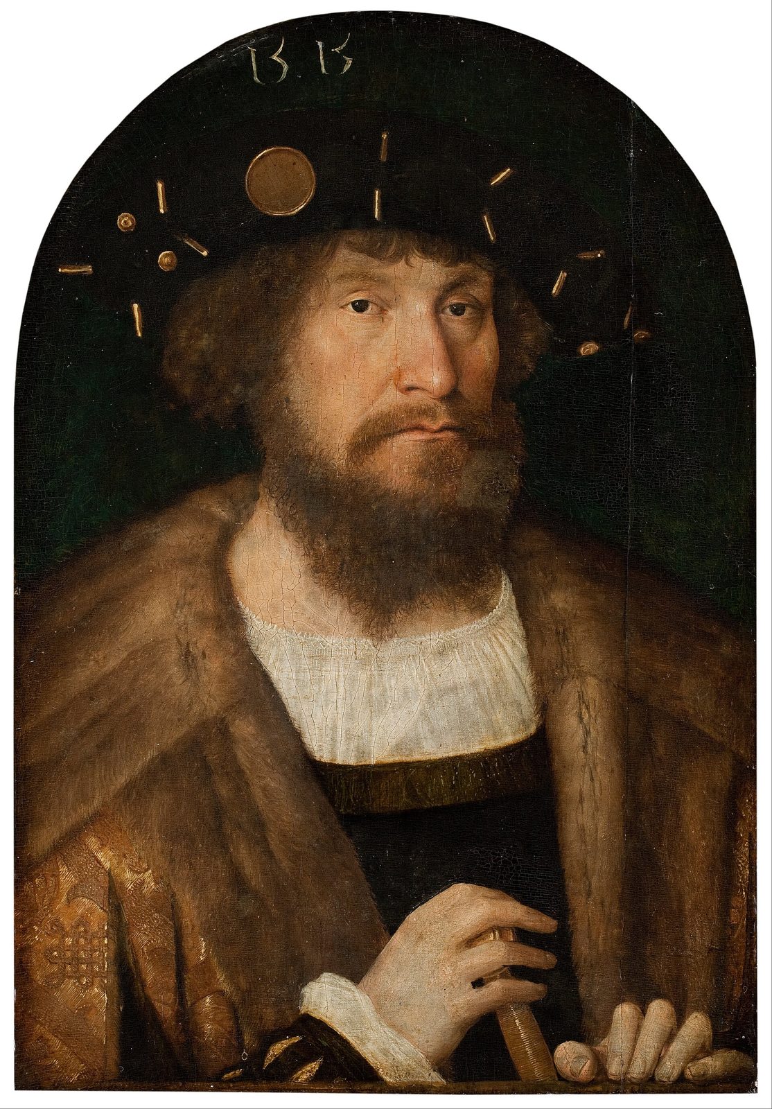 A portrait of a bearded man in a black hat and fur-trimmed coat, his hands resting on a ledge.