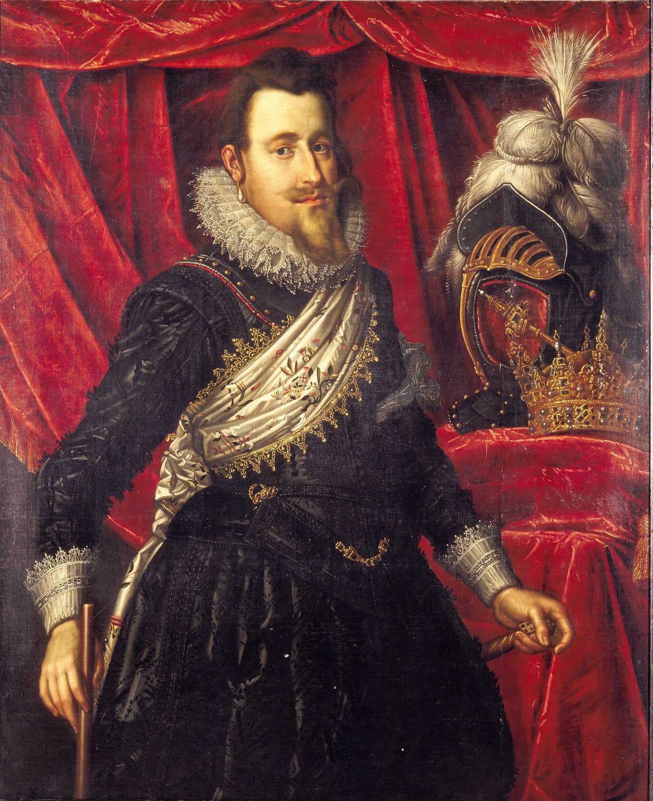 A portrait of a bearded king in black with a white ruff and a gold sash, a plumed helmet and crown on a table beside him.