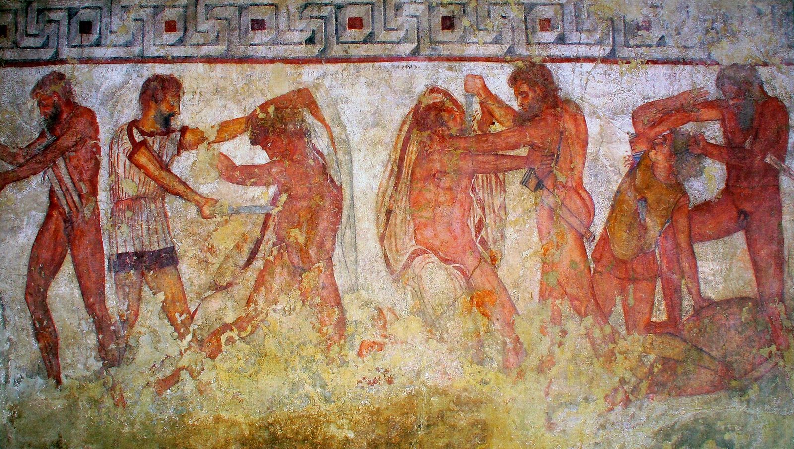 A wall painting of nearly naked warriors fighting with swords, one cutting the bonds of a bound man, figures labelled in Etruscan.