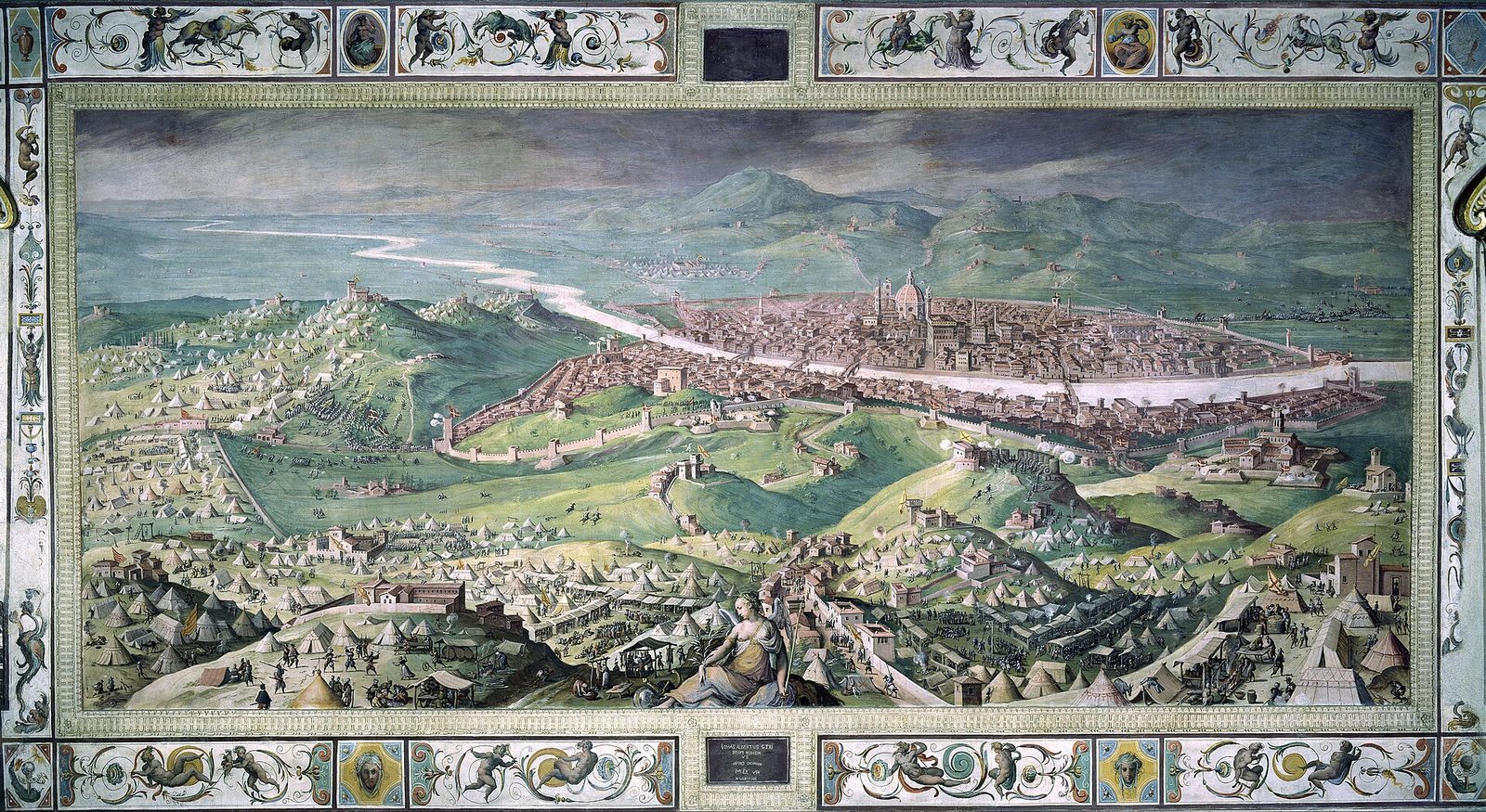 A wide painted panorama of a walled city in a valley seen from a hillside: the cathedral dome and towers at the centre, siege lines and tented camps ringing the walls, and columns of troops moving across the fields in the foreground.