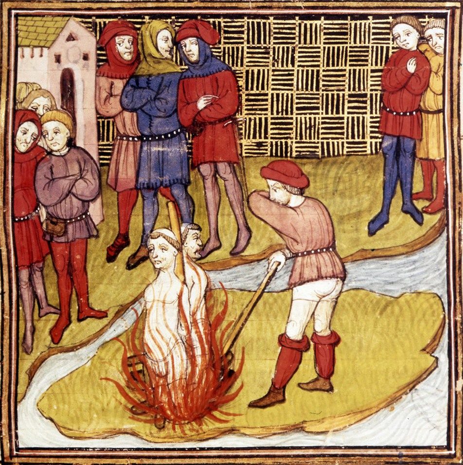 A manuscript miniature of a man standing in flames on a pyre, hands joined, while a workman rakes the fire and robed figures look on from behind a patterned wall.