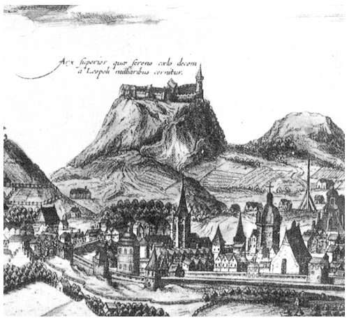 An engraving of a castle on a steep hill above a walled town with church spires.
