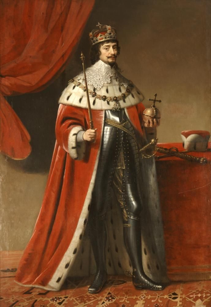 A painted portrait of a young king in coronation robes beside a table with a crown.