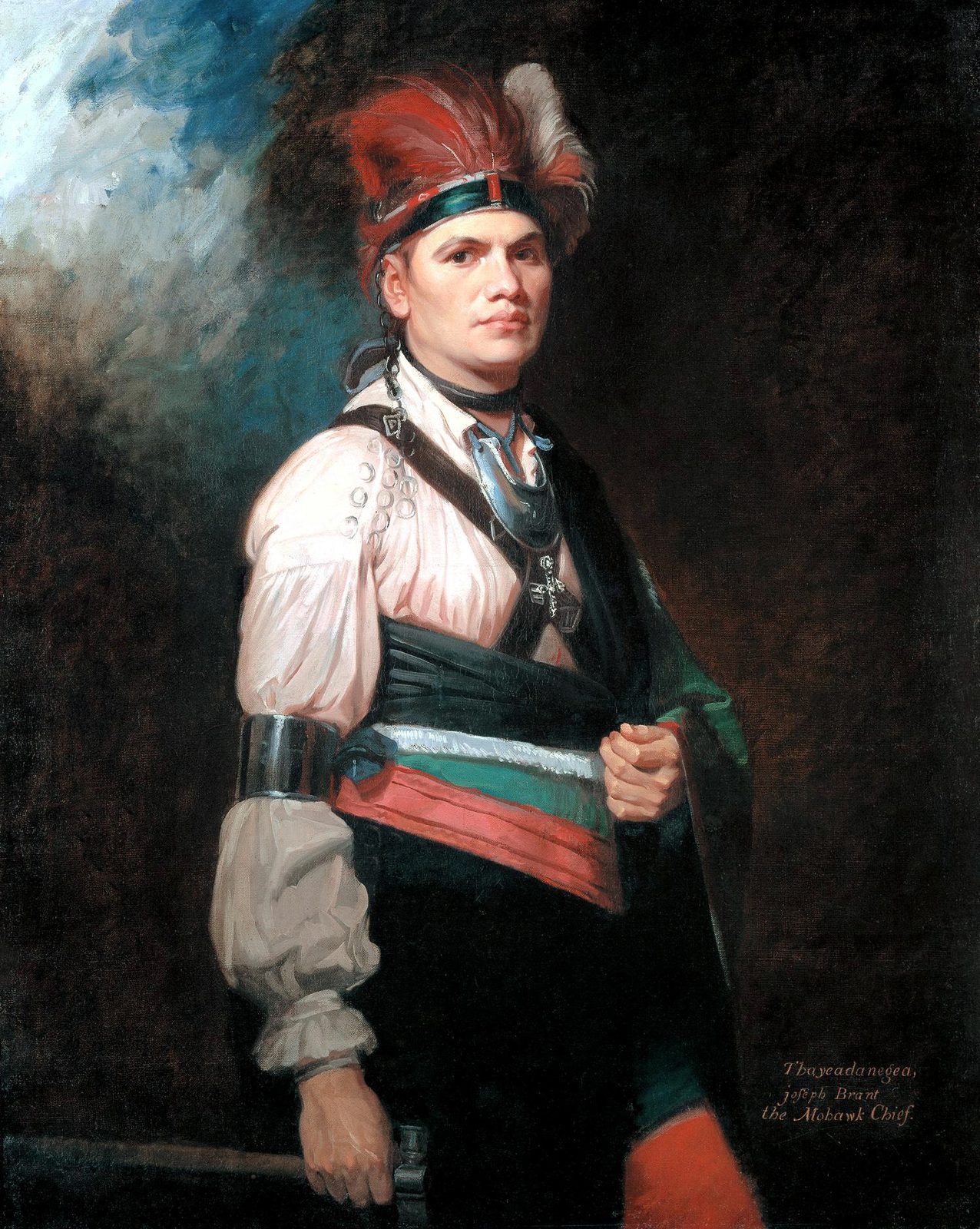 A portrait of a man in a feathered headdress and a white shirt with a silver gorget, a blanket over his shoulder.