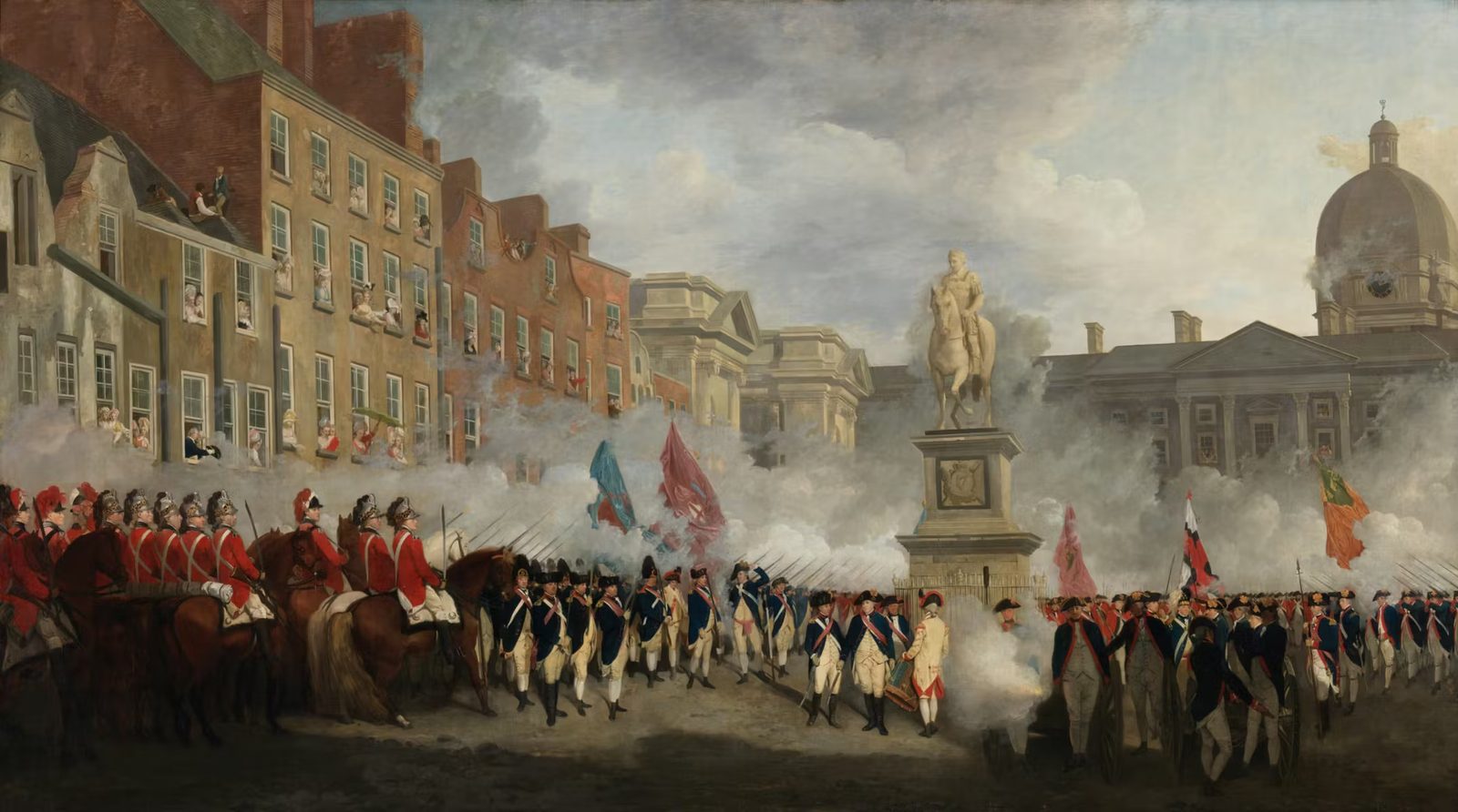 A painting of uniformed volunteers firing a volley around a statue in a city square, onlookers at the windows.