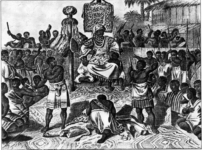 An engraving of a king seated on a dais under a patterned canopy, courtiers and dancers crowded before him.