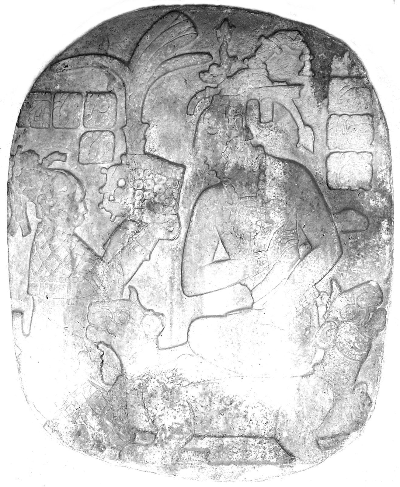 An oval carved stone panel showing a seated woman offering a headdress to a seated man, its outlines traced in black.