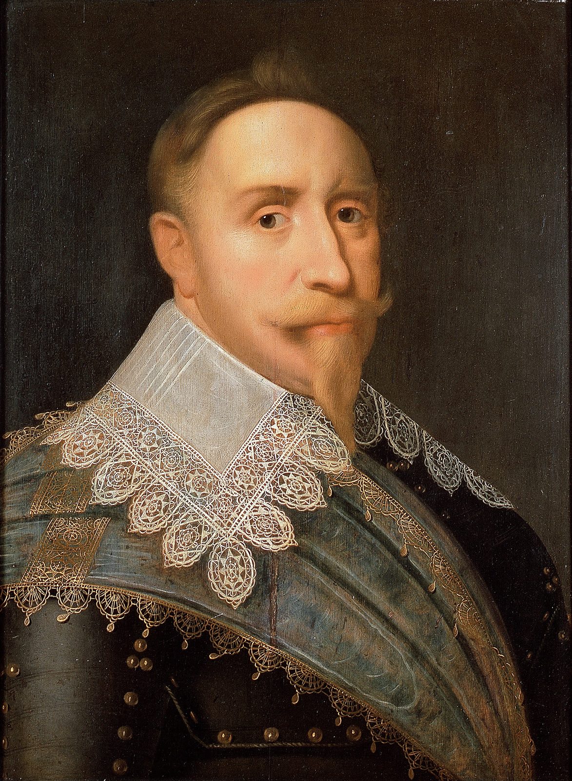 A portrait of a stout man with a pointed beard and moustache in a wide lace collar over armour.