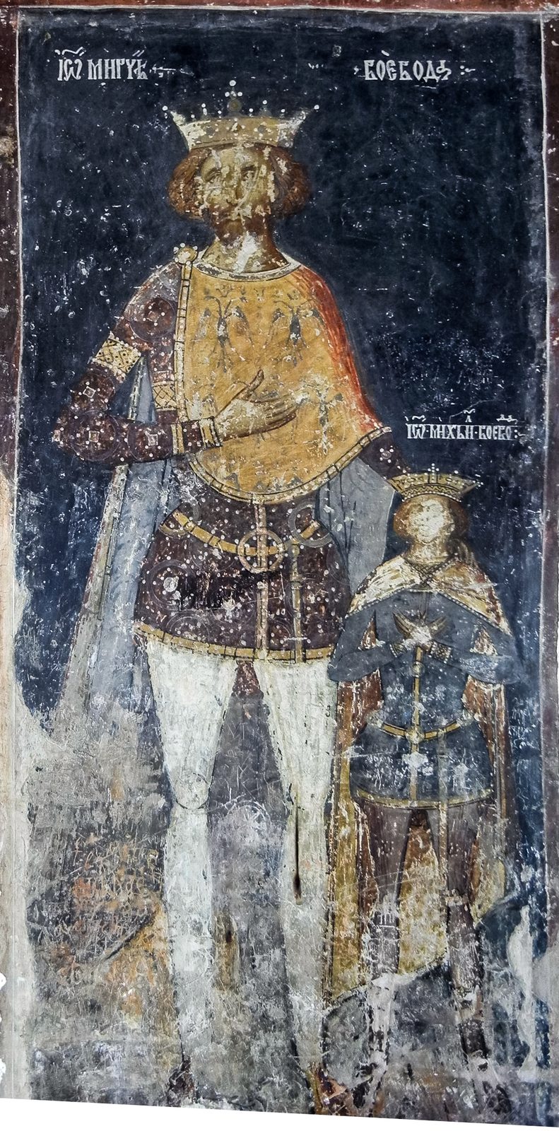 A fresco of a crowned ruler in a long patterned robe beside a smaller crowned youth.