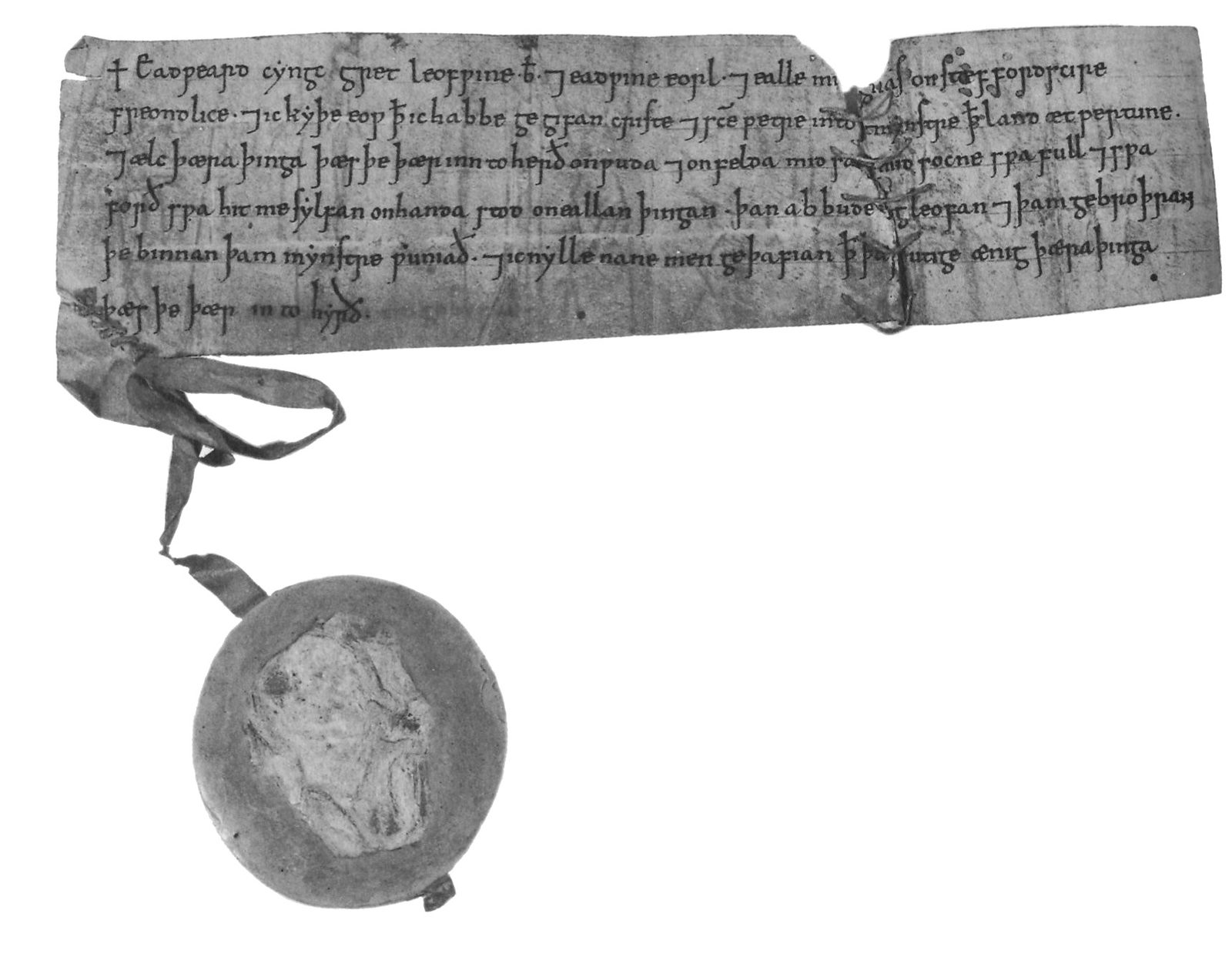 A short strip of parchment in Old English script, with a wax seal hanging from a tag.