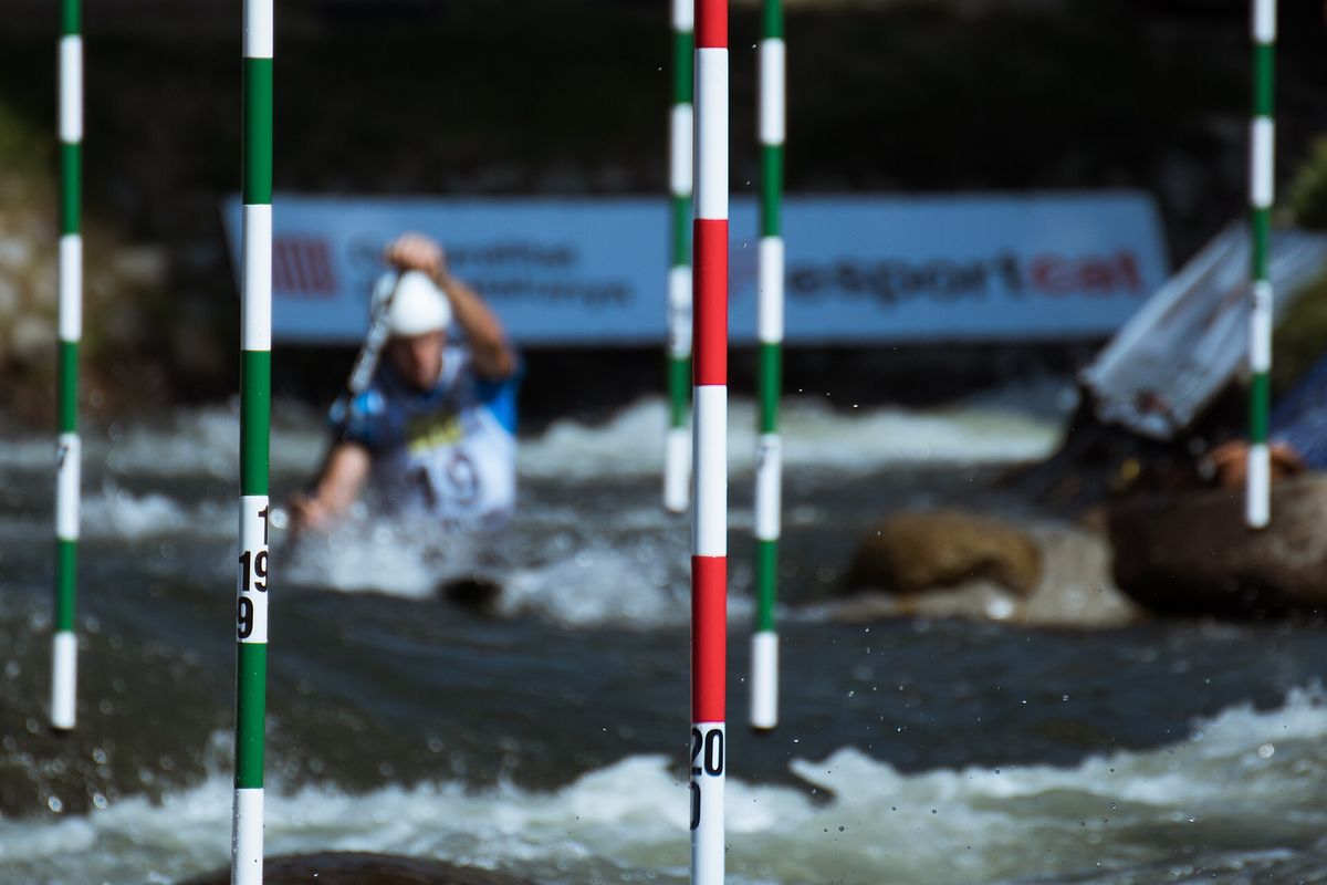 A paddler through the gates at La Seu d'Urgell, Spain, 2019 World Championships.