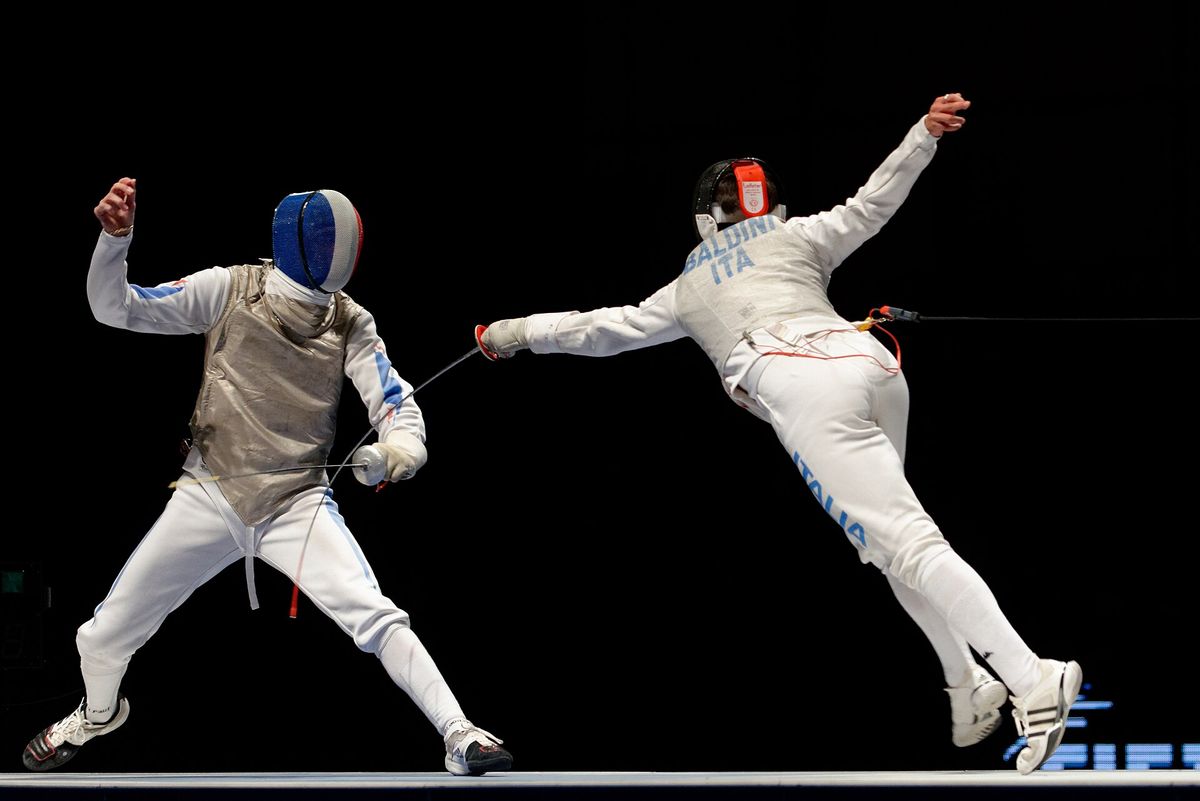 Jérémy Cadot of France parrying a flèche from Andrea Baldini of Italy, foil, Paris, 2013.
